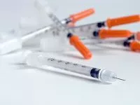 pile of syringes - needles