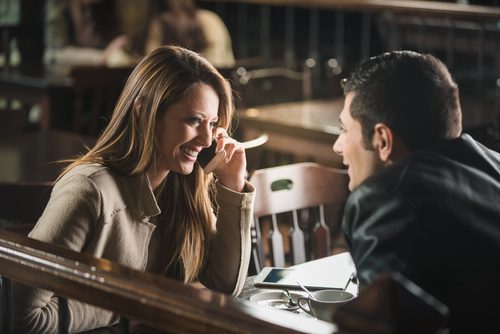 couple laughing at coffee shop