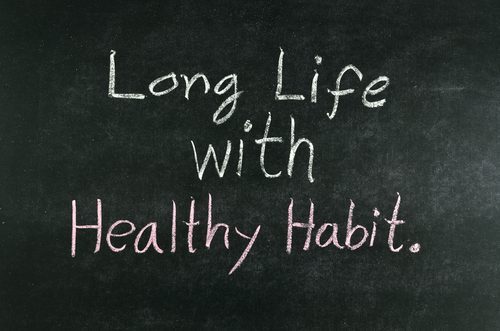 words "Long Life with Healthy Habit" written on chalkboard