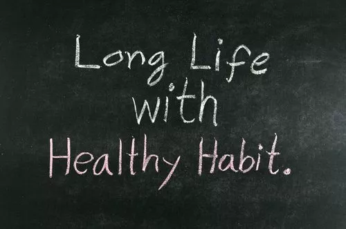 words "Long Life with Healthy Habit" written on chalkboard