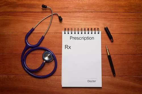 prescription pad and stethescope