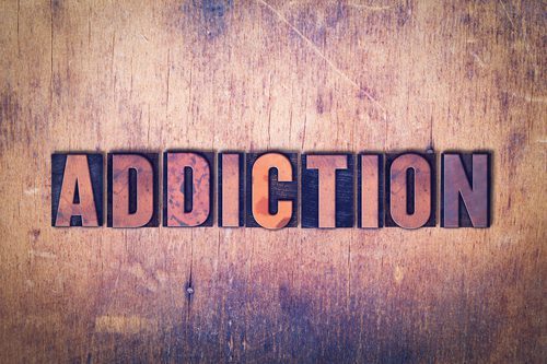 addiction spelled out in wooden blocks