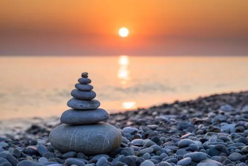 rocks stacked on beach meditation concept