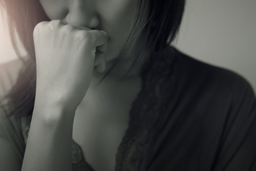 black white image stressed worried woman