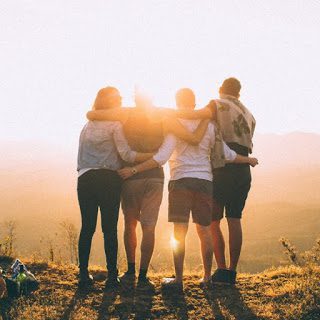 group of friends with arms around each other