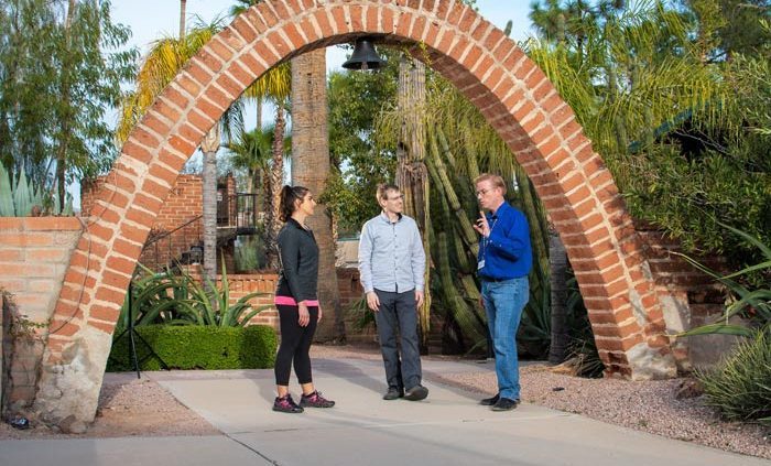 3 people taking under brick arch - Cottonwood Tucson holistic treatment for mood disorders and addiction - photo tour