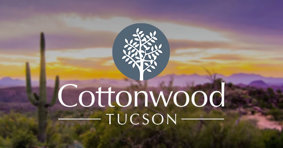 Cottonwood Tucson Logo in front of Arizona desert sunset - Mental Health & Addiction Treatment Programs