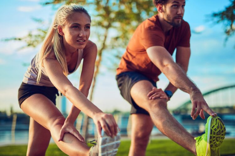 A woman and a man exercising.