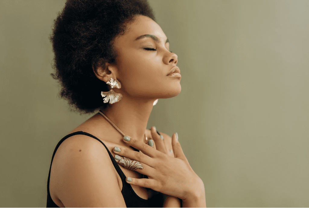 A woman deep in thought, possibly meditating.